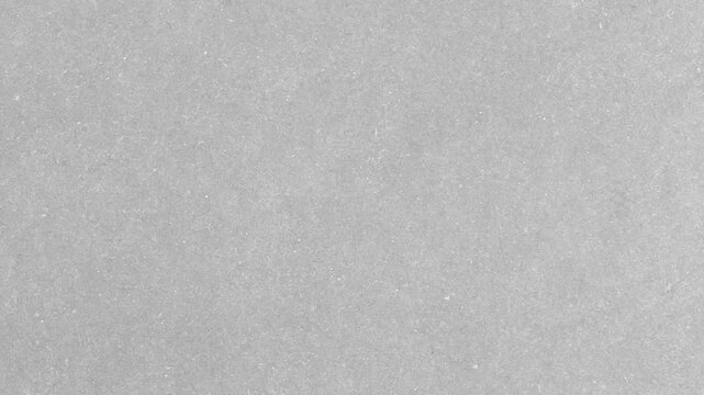 Animated Paper Grain Texture Loop.Seamless looping animation of subtle grain and noise on a light gray paper texture,stop-motion, or overlays.