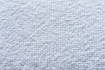 Fototapeta premium A close-up, full frame shot of a light white, textured fabric.