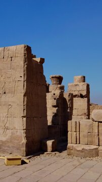Massive pylon facade of Edfu Temple with giant pharaoh reliefs and central gateway, Egypt. Best preserved ancient Egyptian temple exterior for travel and history projects