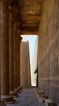Temple of Edfu with massive carved columns and detailed hieroglyphs, revealing the atmosphere of Ancient Egyptian architecture and sacred space. Egypt