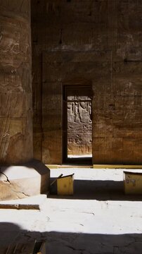 Temple of Edfu with massive carved columns and detailed hieroglyphs, revealing the atmosphere of Ancient Egyptian architecture and sacred space. Egypt