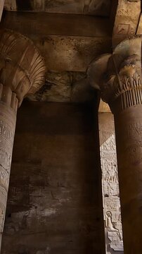 Temple of Edfu with massive carved columns and detailed hieroglyphs, revealing the atmosphere of Ancient Egyptian architecture and sacred space. Egypt
