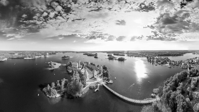 Aerial view of Trakai Castle surrounded by lake and green landscape Lithuania
