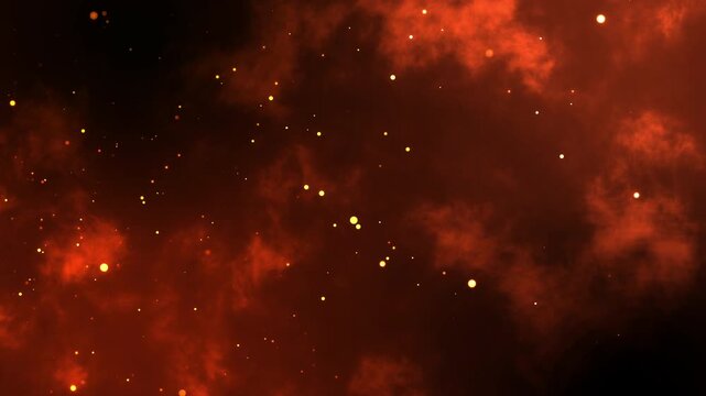 Fiery orange glowing flying ember particles on black background. Burning red hot sparks rise from light fire loop background of bonfire.
