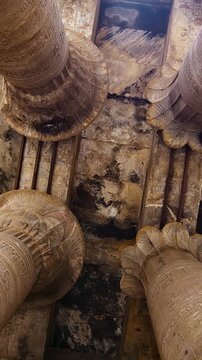 Temple of Edfu with massive carved columns and detailed hieroglyphs, revealing the atmosphere of Ancient Egyptian architecture and sacred space. Egypt