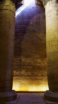 Temple of Edfu with massive carved columns and detailed hieroglyphs, revealing the atmosphere of Ancient Egyptian architecture and sacred space. Egypt