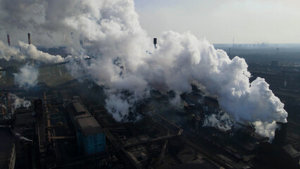 Fototapeta premium Factory, industrial enterprise, metallurgical plant, smoke from chimneys, aerial photography from a drone.