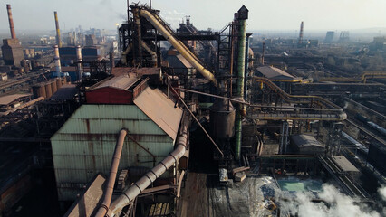 Fototapeta premium Factory, industrial enterprise, metallurgical plant, smoke from chimneys, aerial photography from a drone.