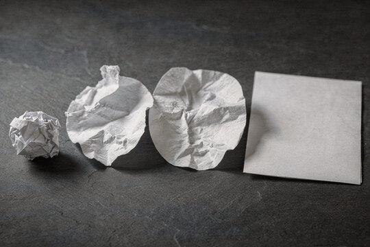 Crumpled Paper Unfolding Step by Step Into a Smooth Sheet