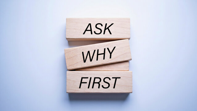 Wooden blocks spelling Ask Why First, first principles thinking concept