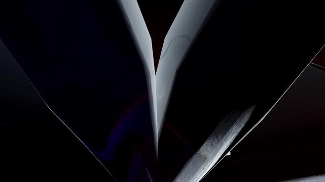 Abstract dark glossy propeller shape with smooth black blades and subtle red and blue neon light glows