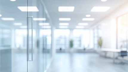 Fototapeta premium Blurred interior of a modern office hallway with glass doors and windows