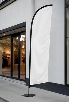 Blank White Feather Flag Banner Mockup on Sidewalk in Front of Modern Retail Storefront with Glass Windows