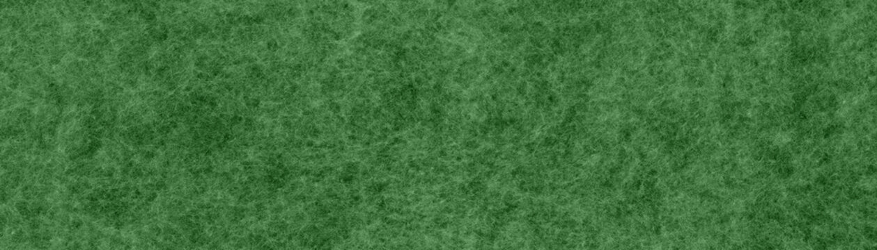 Green felt texture with soft surface and visible fibers. High resolution textile background for design, crafts, decoration and graphic resources.
