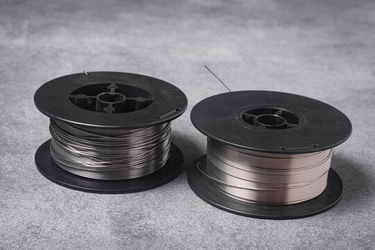 Two MIG Welding Wire Spools Close Up