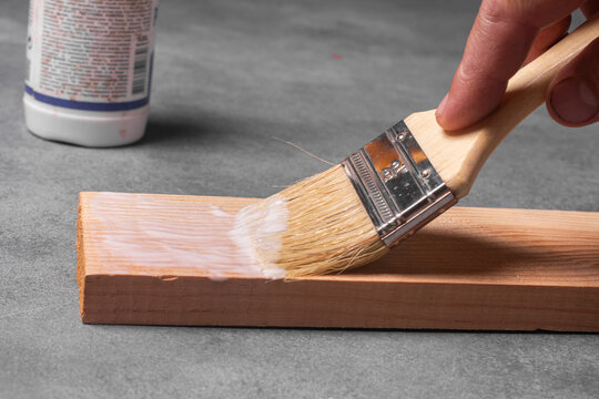Applying Wood Glue to Wooden Board