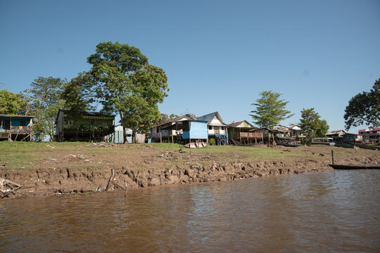  streets and wooden houses on the banks of the Amazon River.