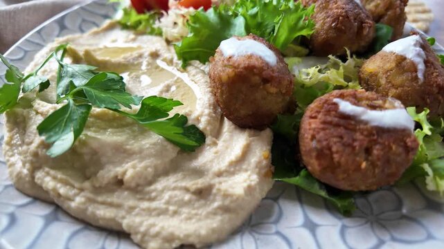 Traditional falafel served with hummus and fresh salad