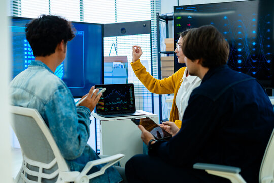 software developer talk strategy plan to executive write prompt AI bot IT app program data analytics in tech startup office.Projected visuals and glowing code on screen.AI chatbot technology concept