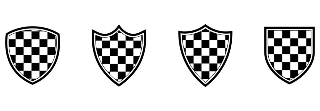Set of four black and white checkered shield emblems for heraldry and racing design elements.