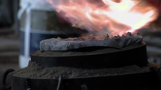 Close Up Of Worker Using Gas Torch To Heat Sealant Layer On Bell Mold - 4K