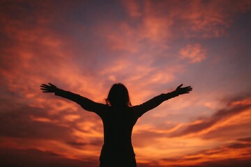 Fototapeta premium Silhouette embracing vibrant sunset sky.