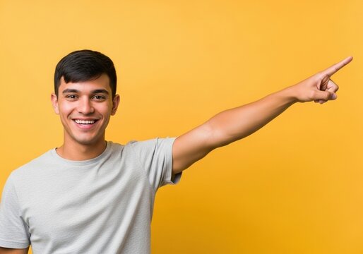 Happy man pointing to the right with a smile
