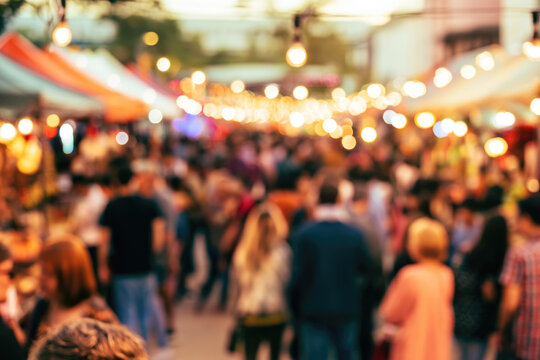 Blurred background of people at street festival celebration