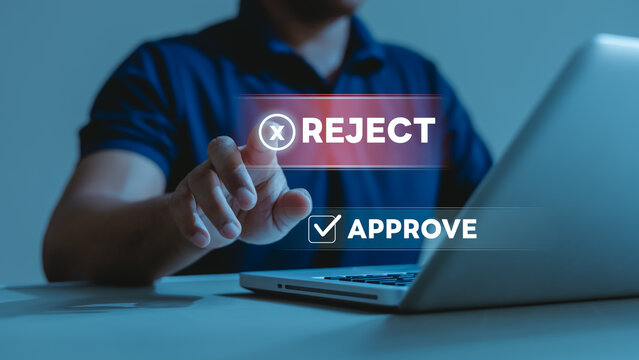 reject approve approval rejection decision business workflow process.Business user selecting reject over approve on digital interface with laptop, illustrating workflow and review.