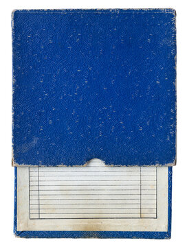 Vintage magnetic audio tape in a worn blue storage sleeve with a blank lined track list label isolated on a white background