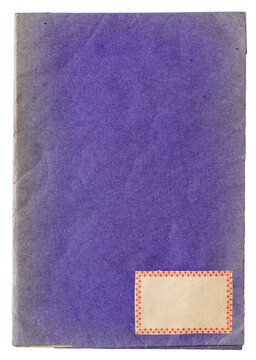 Vintage purple paper notebook cover with small decorative label isolated on white