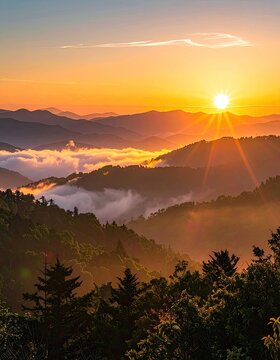 Majestic mountain range bathed in the golden glow of sunrise.