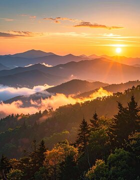 Majestic mountain range bathed in the warm glow of a sunrise.