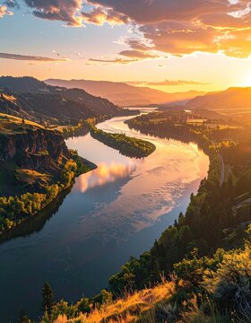 Serene river winding through mountains at sunset