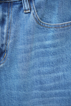  blue jeans. Front pocket and small pocket pants with seam of fashion design. close up, macro. concept business, shopping, sale. Design detail, button and seams, copy space