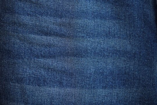 Blue denim jeans texture as background. close up, macro. concept business, shopping, sale. Design detail, copy space