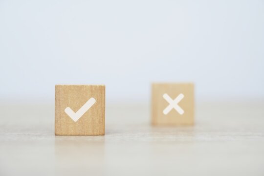 Wooden Blocks with Signs Decision-making concepts are represented by yes-no that represent choice symbols. Think with yes or no options.