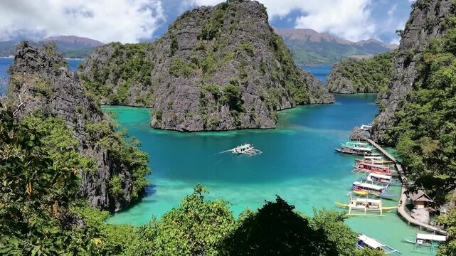 Picturesque  view of Kayangan Lake viewpoint, Coron island, Palawan, Philippines, with outrigger boats and karst scenery. Tourist destination and natural scenic view 