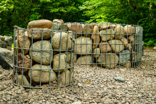 Stone picnic table and chairs set in outdoor forest park area