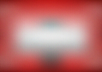 Obraz premium Rich red gradient with soft white central highlight and subtle grain texture creating a warm dynamic overlay