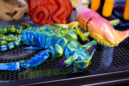 Colorful toy printed on 3D printer. Art multicolored model printed on 3D printer from molten plastic. FDM technology. Fused Deposition Modeling. Additive modern manufacturing technology. 3D printing