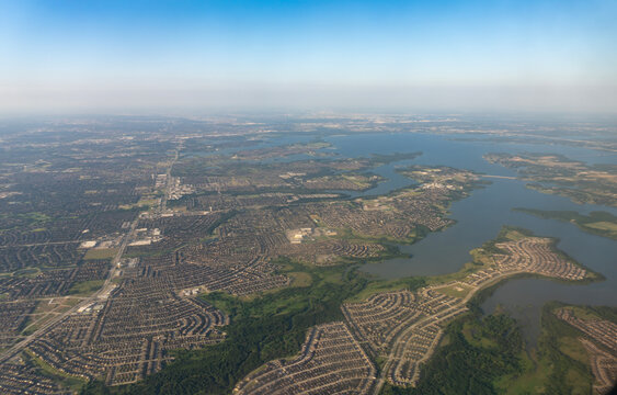 Texas Sprawl: High-Altitude Aerial View of Lewisville Lake and Surrounding Residential Subdivisions near Dallas, Texas