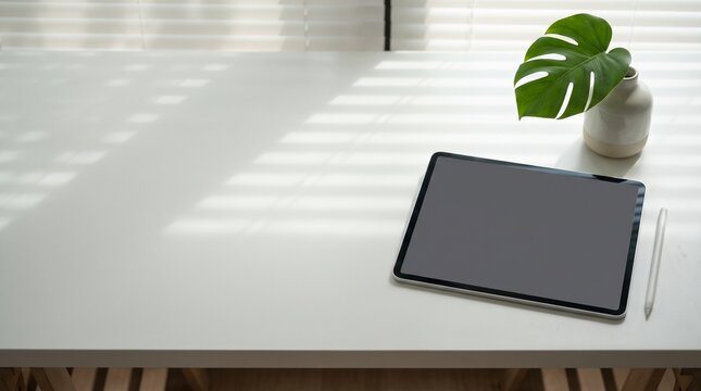 Creative workspace with digital tablet on a white desk 3