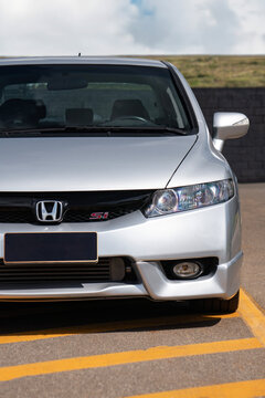 Silver Honda Civic Si front end view, performance sports sedan exterior detail