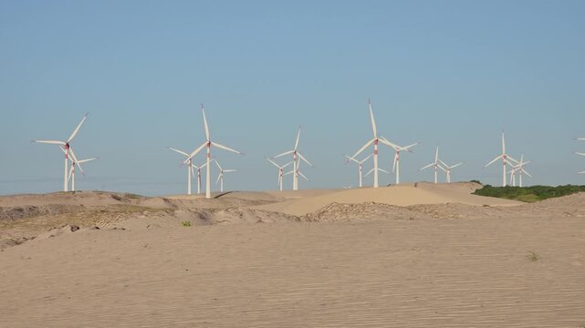 Wind Turbines on Coastal Sand Dunes at Trairi Wind Farm. Cear&aacute;, Brazil