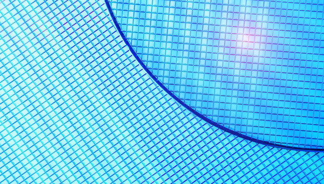 blue silicon wafer for manufacturing semiconductor of integrated circuit.Electronic circuit designs have been built onto the wafers using micromaching including photolithography