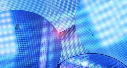 blue silicon wafer for manufacturing semiconductor of integrated circuit.Electronic circuit designs have been built onto the wafers using micromaching including photolithography © xiaoliangge