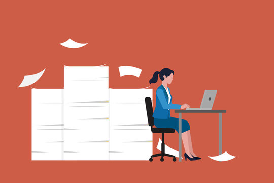 Overwhelmed woman working on his laptop at a desk under the pressure and looming deadlines