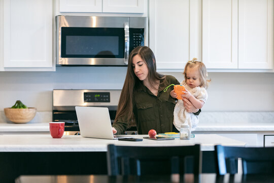 Mother Overloaded With Kids And Work