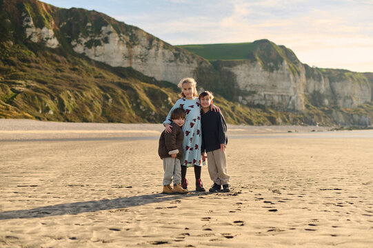 Three children on a sunny beach